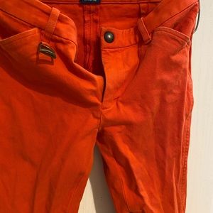Orange rider pants from Ralph Lauren. Size 2 used , in good condition.